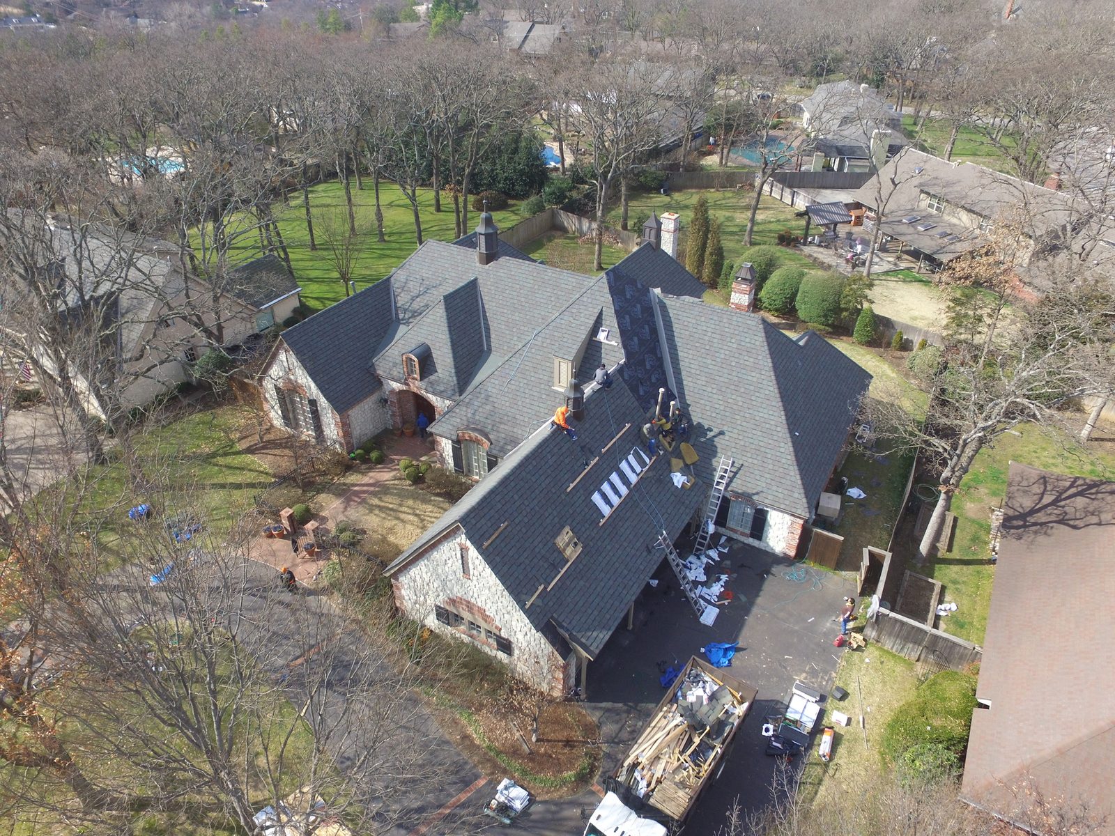 Overhead photo of a Precise Roofing crew at work